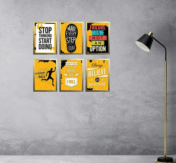 Set of six black frames forming a motivational quote collage with yellow and black designs, mounted on gray wall next to. - 6 Pcs Office Motivational Quotes Frames - 8x12" / Black - Frame World