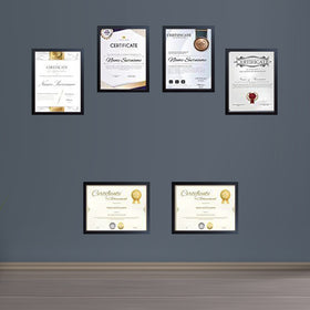 Black and white diploma and certificate frames arranged in a custom collage on gray wall. - Diploma/ Certificate Frames A4 Size - Black / Pack of 2 - Frame World