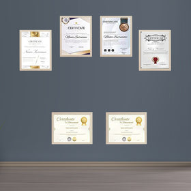 Gold diploma frames with certificates arranged in a custom collage on gray wall. - Diploma/ Certificate Frames A4 Size - Black / Pack of 2 - Frame World