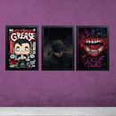 Three black framed boys gaming room wall frames featuring Grease, Batman, and Suicide Squad artwork on purple wall