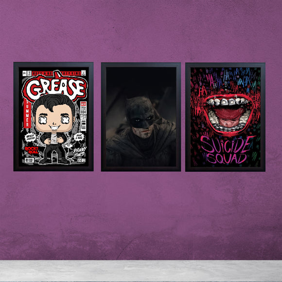 Three black framed boys gaming room wall frames featuring Grease, Batman, and Suicide Squad artwork on purple wall