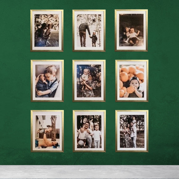 Nine 10x12 inch glass front frames with custom pictures arranged in a 3x3 grid on a green wall.