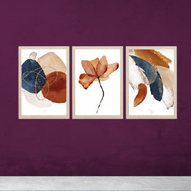 Set of 3 abstract photo frames with golden, white, and black synthetic wood frames on purple wall background.