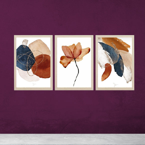 Set of 3 abstract photo frames with golden, white, and black synthetic wood frames on purple wall background.
