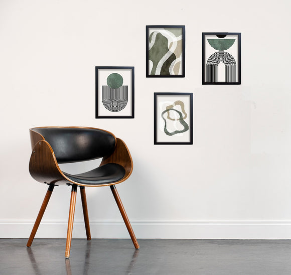 Set of 4 black frames with abstract green and beige art collage on white wall above modern wooden chair with black leather. - Set of 4 Abstract Art Frame set - 8x12" / Black - Frame World