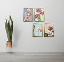 Set of 4 golden photo frames arranged in custom collage with floral artwork on white wall. - Set of 4 Aesthetic Wall Decoration Photo Frames - 8x12" / Black - Frame World