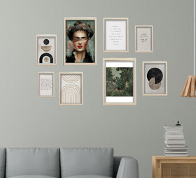 White custom collage frames in varied sizes with abstract and portrait art on a light gray wall above a gray sofa. - 8 Pcs Aesthetic Abstract Photo Frame set for Wall 12" x 16" (2 piece) , 8" x 12" (4 pieces) and 6" x 8" (2 pieces) - Black - Frame World