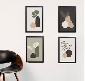 Set of 4 black frames with abstract art collage, arranged in custom wall display above wooden chair. - Set of 4 Abstract Photo Frames - 8x12" / Black - Frame World