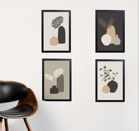 Set of 4 black frames with abstract art collage, arranged in custom wall display above wooden chair. - Set of 4 Abstract Photo Frames - 8x12" / Black - Frame World