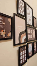 Black collage photo frames set arranged on a wall featuring custom artwork in various sizes. - Pack of 12- Collage Photo Frames set - Black - 11 pc - Frame World