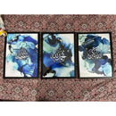 Set of 3 modern Islamic wall art frames with black frames and blue abstract background designs, glossy glass covered prints.