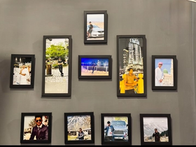 Set of 10 black collage frames arranged on wall showcasing custom photos in various rectangular shapes. - Set of 10 Collage Photo Frames - Black - Frame World