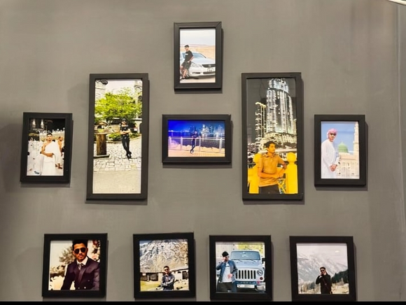 Set of 10 black collage frames arranged on wall showcasing custom photos in various rectangular shapes. - Set of 10 Collage Photo Frames - Black - Frame World