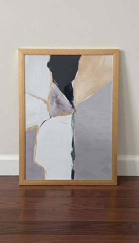 Abstract painting in a wooden frame on a wall