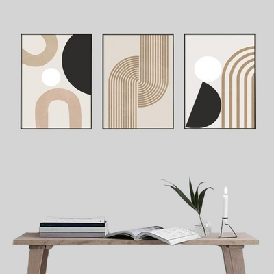 Three abstract art prints on a wall 