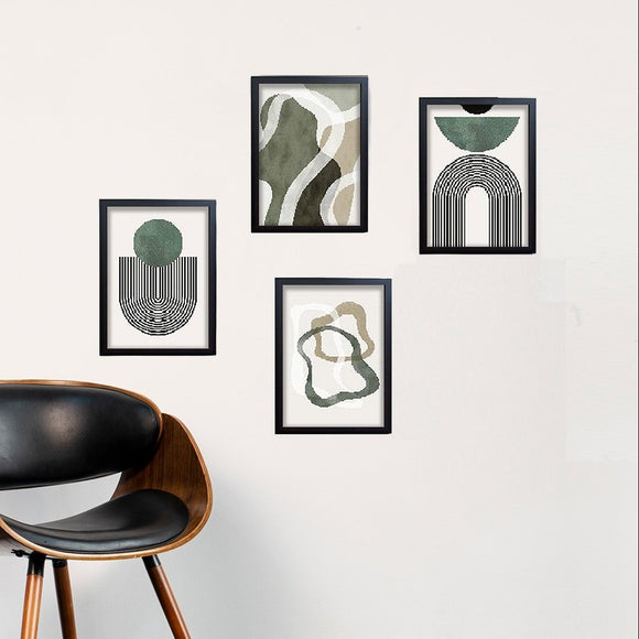 Set of 4 black frames with abstract green and beige art collage on white wall above modern wooden chair with black leather. - Set of 4 Abstract Art Frame set - 8x12" / Black - Frame World