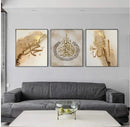 Three-piece Islamic calligraphy collage with custom golden script in black frames above gray sofa. - 3-Piece Islamic Calligraphy Art Frame Set – Customizable Wall Decor - 8x12 / Black - Frame World