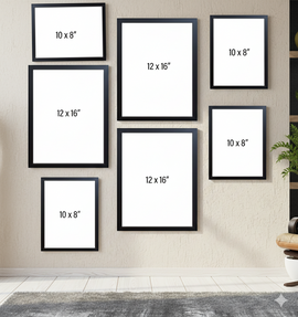 Set of black picture frames with white mats on a wall, displaying various sizes.