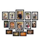 Collection of black photo frames with family portraits on a white background