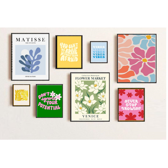 Collection of colorful framed artworks on a white wall