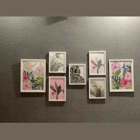 Set of framed botanical prints on a gray wall