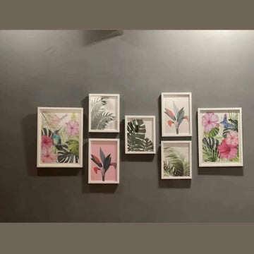 Set of framed botanical prints on a gray wall