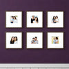 Set of six custom square photo frames arranged in a collage gallery on a purple wall displaying family pictures.