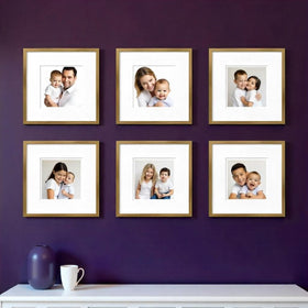 Set of six custom square photo frames displaying family portraits in a stylish collage gallery wall arrangement