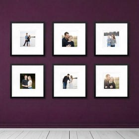 Set of six black custom square photo frames displayed on a purple wall with family and couple photos inside.