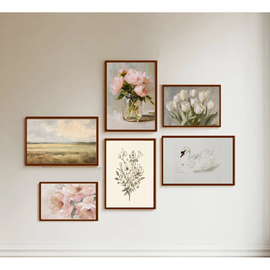 Set of framed artworks on a wall, including floral and landscape scenes.