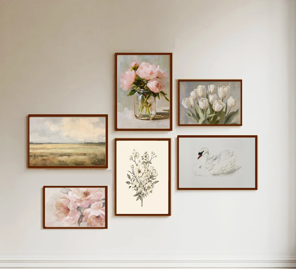Set of framed artworks on a wall, including floral and landscape scenes.