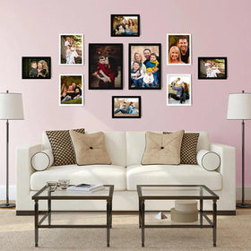 Set of 10 black and white collage frames in various sizes arranged on pink wall above white sofa with beige and patterned. - Collage Wall Photo Frame Set of 10 – Customizable Multi-Size Display - Black - Frame World