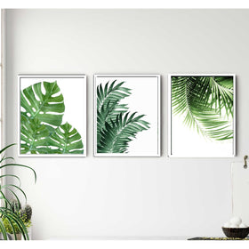 Three custom white frames with tropical leaf collage prints in 8x10" size on white wall. - 3-Piece Tropical Leaf Wall Frame Set – Modern Botanical Decor - 8x10" / Black - Frame World
