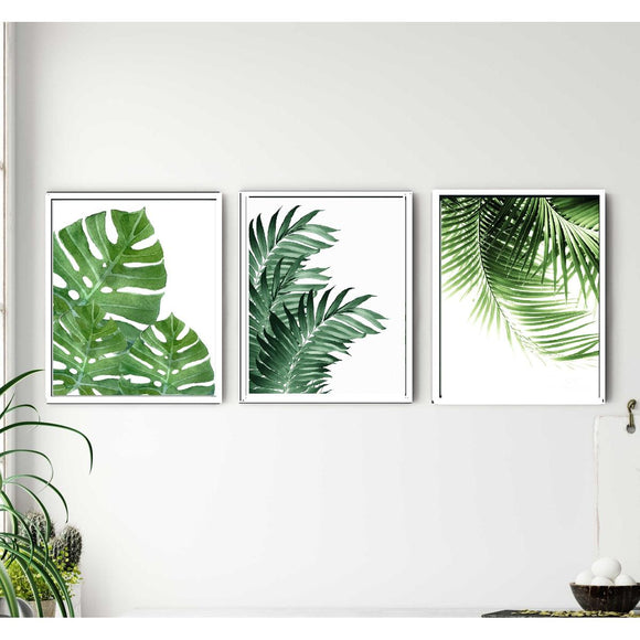 Three custom white frames with tropical leaf collage prints in 8x10" size on white wall. - 3-Piece Tropical Leaf Wall Frame Set – Modern Botanical Decor - 8x10" / Black - Frame World
